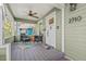 Inviting covered front porch with outdoor seating and ceiling fan for relaxing at 2710 2Nd N Ave, St Petersburg, FL 33713