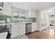 Charming kitchen featuring stainless steel appliances and light countertops, conveniently located next to the laundry area at 2710 2Nd N Ave, St Petersburg, FL 33713