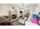 Cozy living room featuring a brick fireplace, hardwood floors, and comfortable seating at 2710 2Nd N Ave, St Petersburg, FL 33713