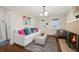 Bright living room featuring a brick fireplace, hardwood floors, and comfortable seating at 2710 2Nd N Ave, St Petersburg, FL 33713