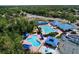 Aerial view showcasing the community pool with several pools and a splash pad at 29042 Rivergate Run, Wesley Chapel, FL 33543