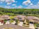 Aerial street view of attractive single-Gathering homes featuring manicured lawns, and attached two car garages at 30327 Lettingwell Cir, Wesley Chapel, FL 33543