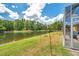 Enjoy scenic backyard views with waterfront access in this beautiful Florida home at 30327 Lettingwell Cir, Wesley Chapel, FL 33543