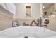 Soaking tub with decorative accents and stylish fixtures at 30327 Lettingwell Cir, Wesley Chapel, FL 33543