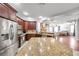 Kitchen showcasing granite countertops, stainless appliances, and modern cabinetry at 30327 Lettingwell Cir, Wesley Chapel, FL 33543