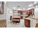 Well-equipped kitchen features stainless steel appliances, granite countertops and tile floors at 30327 Lettingwell Cir, Wesley Chapel, FL 33543