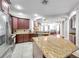 Kitchen showcasing granite countertops, stainless appliances, and modern cabinetry at 30327 Lettingwell Cir, Wesley Chapel, FL 33543