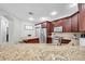 Kitchen showcasing granite countertops, stainless appliances, and modern cabinetry at 30327 Lettingwell Cir, Wesley Chapel, FL 33543