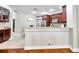 Kitchen featuring granite countertops, and view to the dining and Gathering rooms at 30327 Lettingwell Cir, Wesley Chapel, FL 33543