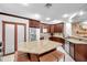 Well-equipped kitchen features stainless steel appliances, granite countertops and tile floors at 30327 Lettingwell Cir, Wesley Chapel, FL 33543