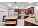 Well-equipped kitchen features stainless steel appliances, granite countertops and tile floors at 30327 Lettingwell Cir, Wesley Chapel, FL 33543