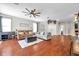 Cozy living room features hardwood floors and comfortable seating for relaxing or entertaining at 30327 Lettingwell Cir, Wesley Chapel, FL 33543