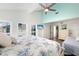 Airy bedroom with high ceilings, a ceiling fan, and lots of natural light from the windows at 337 Rex Pl # G, Madeira Beach, FL 33708