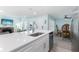 Features a spacious island, stainless steel appliances, and an open layout connecting to the dining and living areas at 337 Rex Pl # G, Madeira Beach, FL 33708