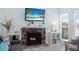 Relaxing living room featuring a cozy fireplace, comfortable seating, and stylish decor at 337 Rex Pl # G, Madeira Beach, FL 33708
