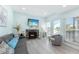 Relaxing living room featuring a cozy fireplace, comfortable seating, and stylish decor at 337 Rex Pl # G, Madeira Beach, FL 33708