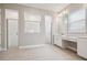 Bright bathroom with double showers, white tile, and tile flooring at 34084 Torrent Ln, Wesley Chapel, FL 33543