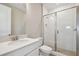 Bathroom featuring a single sink vanity with a stone countertop and glass shower at 34084 Torrent Ln, Wesley Chapel, FL 33543