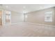 Neutral bedroom featuring carpeted flooring, closet and ensuite bathroom at 34084 Torrent Ln, Wesley Chapel, FL 33543