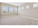 Carpeted bedroom featuring a large window and neutral walls at 34084 Torrent Ln, Wesley Chapel, FL 33543