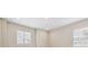 Bright bedroom features natural light, recessed lighting, and neutral paint at 34084 Torrent Ln, Wesley Chapel, FL 33543