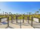 Community dog park featuring separate areas for small and large dogs, with lush landscaping and sunny skies at 34084 Torrent Ln, Wesley Chapel, FL 33543