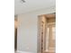 Hallway with neutral walls and trim, with views of other rooms at 34084 Torrent Ln, Wesley Chapel, FL 33543