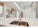 Bright open kitchen with large island, stainless appliances, and view of the staircase at 34084 Torrent Ln, Wesley Chapel, FL 33543