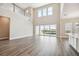 Bright, open living room with high ceilings and sliding glass doors to the backyard at 34084 Torrent Ln, Wesley Chapel, FL 33543