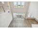 Bright open-concept living space with high ceilings and a wall of sliding glass doors at 34084 Torrent Ln, Wesley Chapel, FL 33543