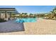 Relaxing community pool featuring a shaded pavilion with ceiling fans and plenty of poolside seating at 34084 Torrent Ln, Wesley Chapel, FL 33543