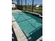 Stunning pool in screened enclosure with beautiful stone surround and backyard views at 34084 Torrent Ln, Wesley Chapel, FL 33543