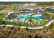 Enjoy the community pool, amenities, and lush tropical landscaping from above at 34084 Torrent Ln, Wesley Chapel, FL 33543