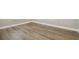 Neutral room showcasing wood floors and clean lines in a minimalist design at 34084 Torrent Ln, Wesley Chapel, FL 33543