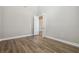 Open room with wood flooring and freshly painted walls, creating a bright, airy space at 34084 Torrent Ln, Wesley Chapel, FL 33543