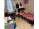 Cozy bedroom with pink themed decorations, a desk, and a bed at 3713 E Clifton St, Tampa, FL 33610