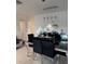 Elegant dining room featuring a modern table with black chairs and stylish lighting at 3713 E Clifton St, Tampa, FL 33610