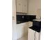 Small kitchenette area featuring upper and lower cabinets at 3713 E Clifton St, Tampa, FL 33610