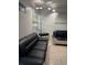 Inviting living room featuring contemporary sofas and a stylish floor lamp at 3713 E Clifton St, Tampa, FL 33610