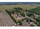 Wide-angle view of the property, displaying the home's location near fields and wooded areas at 38824 Raiser Rd, Dade City, FL 33525
