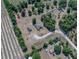 An aerial view of the property with a home and pool, surrounded by trees with plenty of room for parking at 38824 Raiser Rd, Dade City, FL 33525