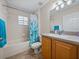 A bathroom with a tub/shower combo, vanity, and toilet at 38824 Raiser Rd, Dade City, FL 33525