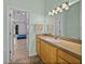 A vanity, sink, and mirror are featured in this bathroom space at 38824 Raiser Rd, Dade City, FL 33525
