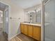 Bathroom with tile floors, double sink vanity, a stand-up shower and an accessible toilet room at 38824 Raiser Rd, Dade City, FL 33525