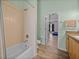 A bathtub, toilet, vanity, and tiled shower are visible in the space at 38824 Raiser Rd, Dade City, FL 33525