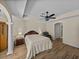 Spacious bedroom featuring wood-look tile flooring, a ceiling fan, and a neutral color palette at 38824 Raiser Rd, Dade City, FL 33525