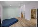 A bedroom with an attached laundry area and bathroom with stone tile at 38824 Raiser Rd, Dade City, FL 33525