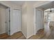 Hallway featuring tile flooring and access to other rooms within the home at 38824 Raiser Rd, Dade City, FL 33525