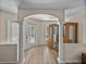 Arched entry with columns lead to a pool with direct access via glass paneled door, and a wood cabinet at 38824 Raiser Rd, Dade City, FL 33525