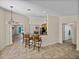 Modern kitchen with bar seating providing seamless flow to living spaces and natural light at 38824 Raiser Rd, Dade City, FL 33525